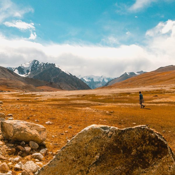 Explore the vast and scenic mountain landscapes with snowy peaks in Pakistan.
